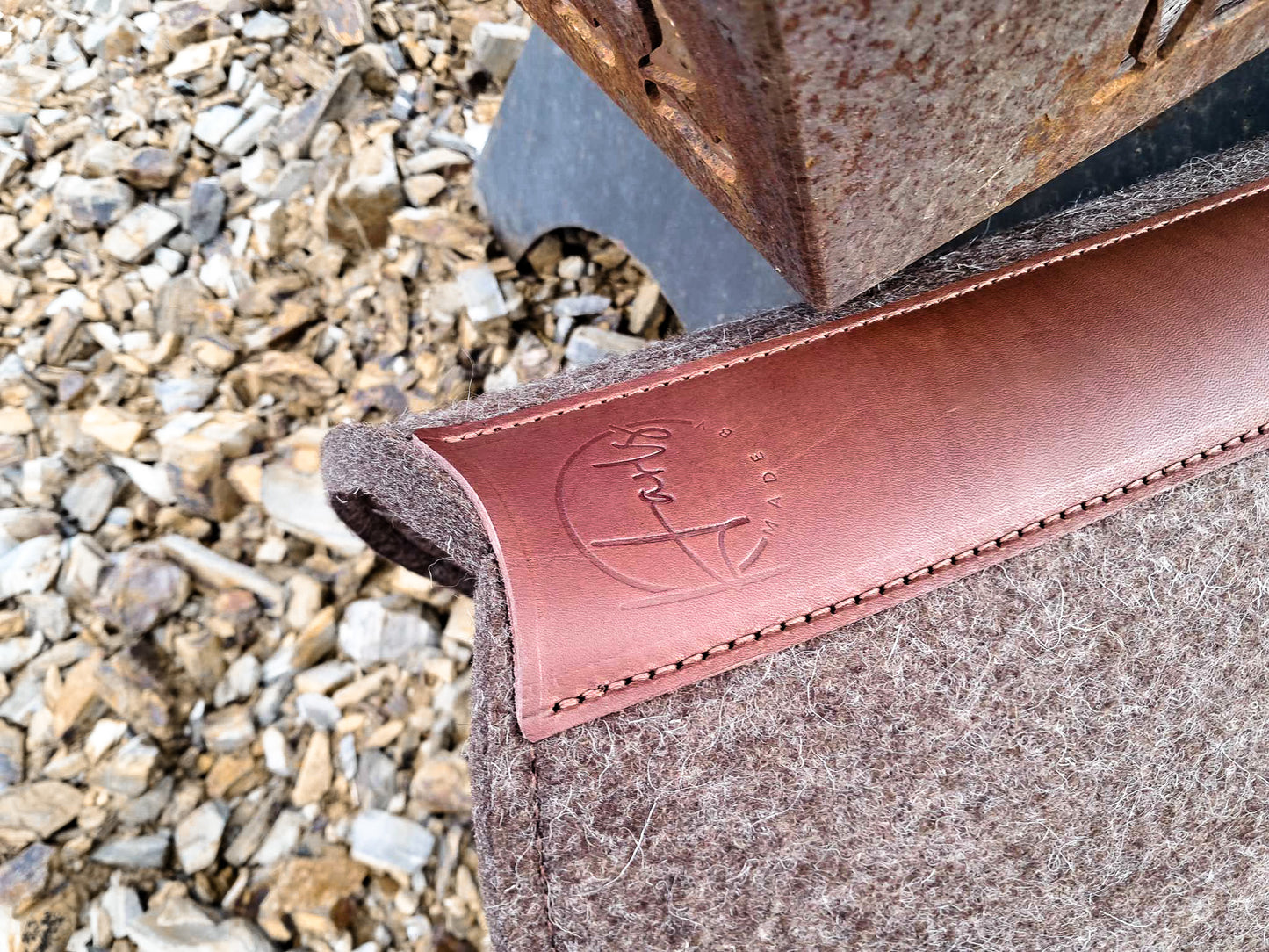 Leather feature, contoured spine, shaped fender pad - 13mm or 18mm felt in choc, grey or cream