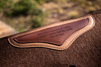 Brown crazyhorse & navy webbing clover spine wool felt pad